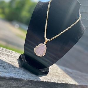 Light pink Bhudda necklace.